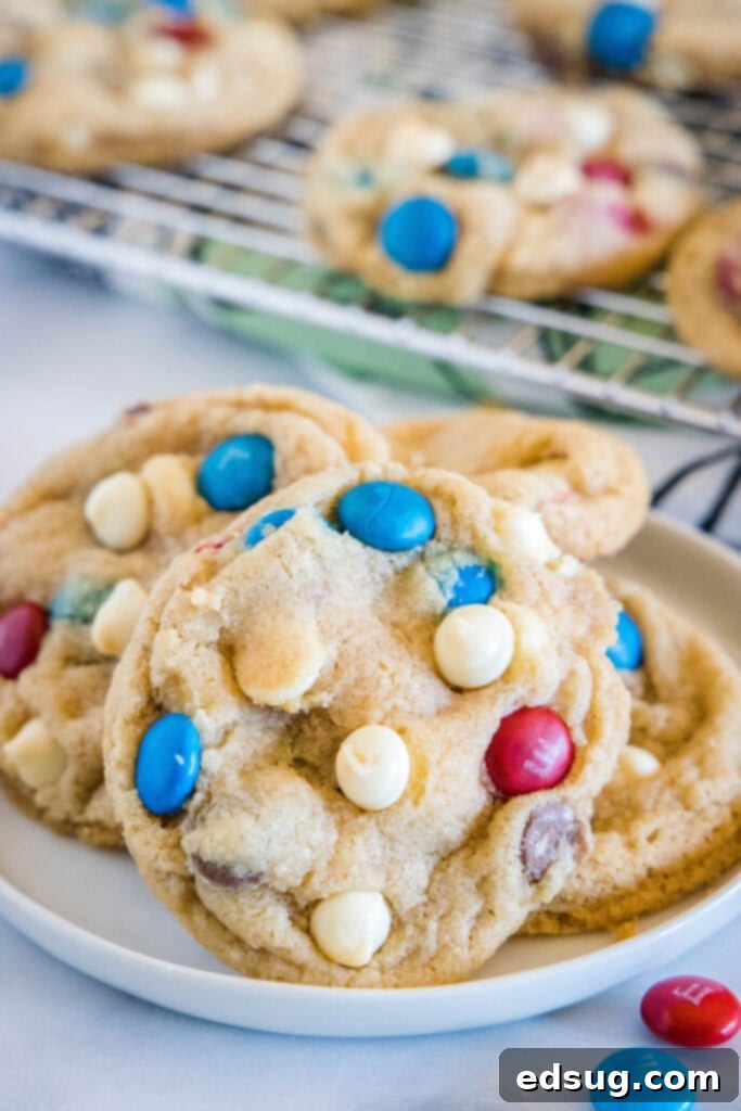 Red, White & Blue Cookies 6 Multiple freshly baked 4th of July cookies stacked on a white plate, ready to serve.