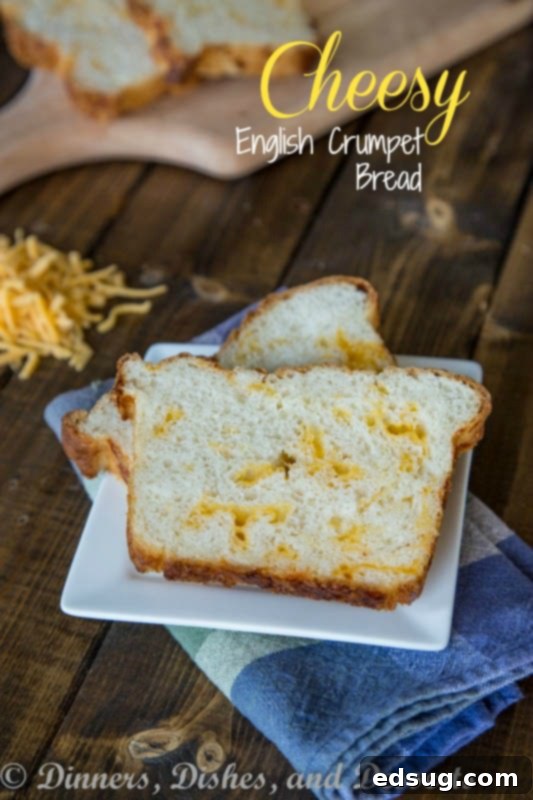 Cheesy Crumpet Loaf 2 Golden brown cheesy English crumpet bread, sliced on a plate, ready to be enjoyed.
