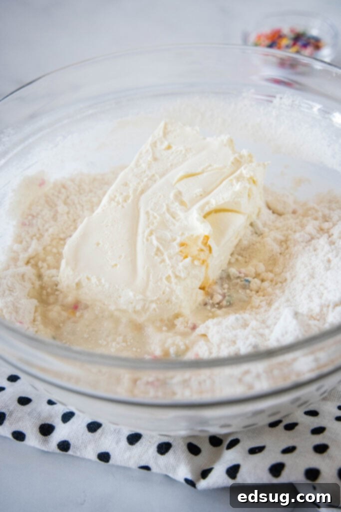 Cake batter dip ingredients combined in a glass bowl. Cake batter dip ingredients combined in a glass bowl, before folding in whipped topping.