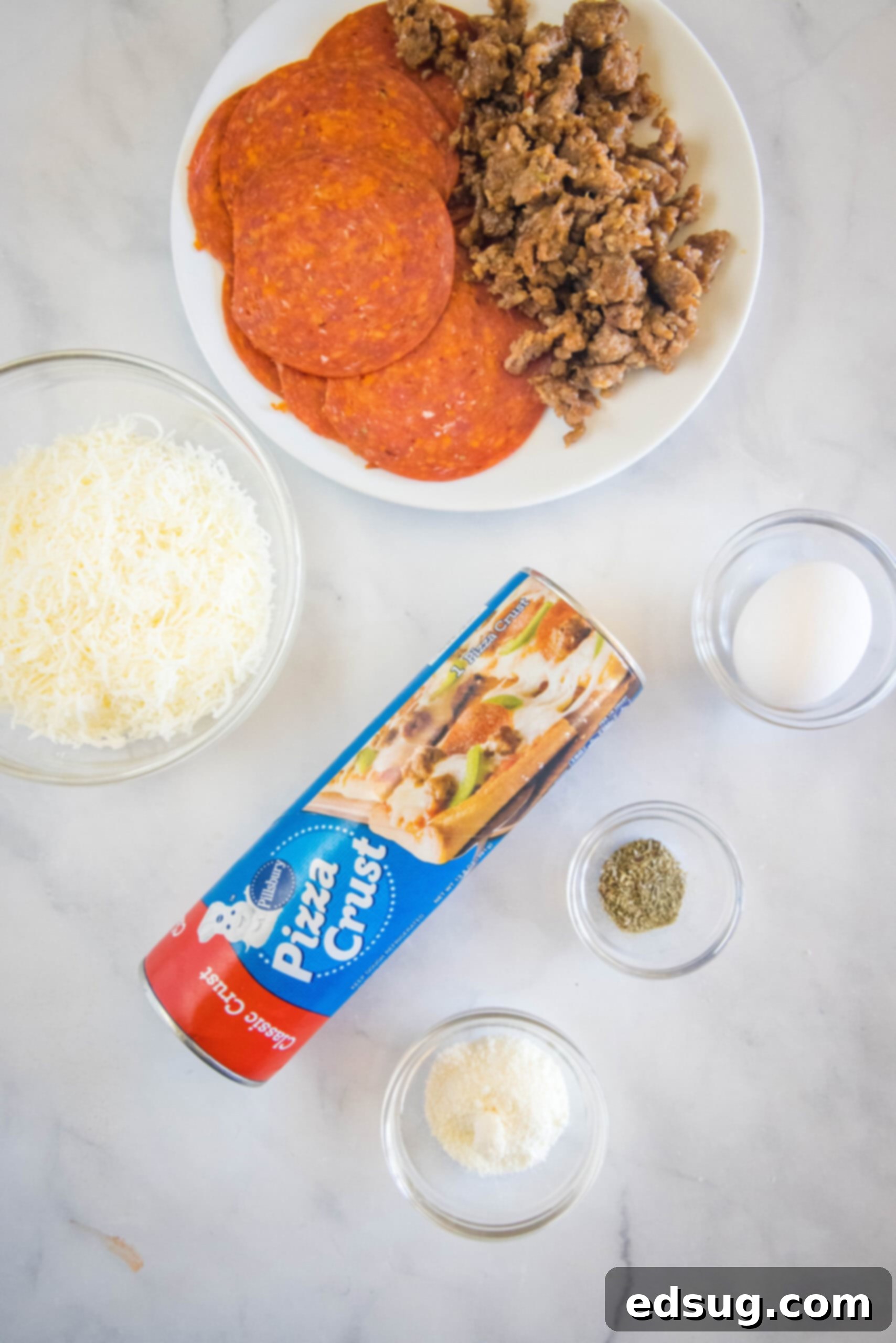 Put a fun spin on pizza night with this easy pizza bread recipe. Roll your favorite pizza toppings inside a pizza crust, bake, and slice! #pizzabread #pizza Pizza bread ingredients.