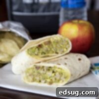 Creamy Avocado Chicken Salad Wrap 1 A sandwich sitting on top of a table