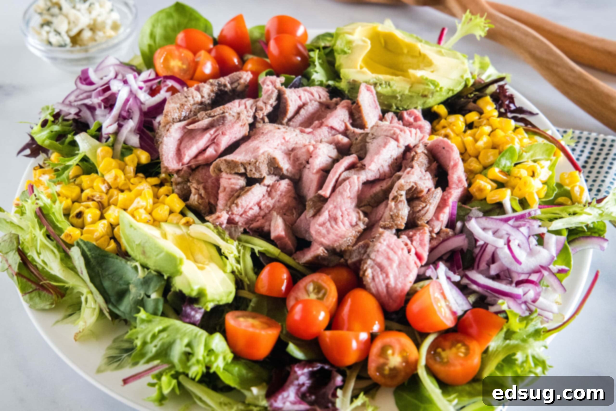 Steak salad served on a large platter.
