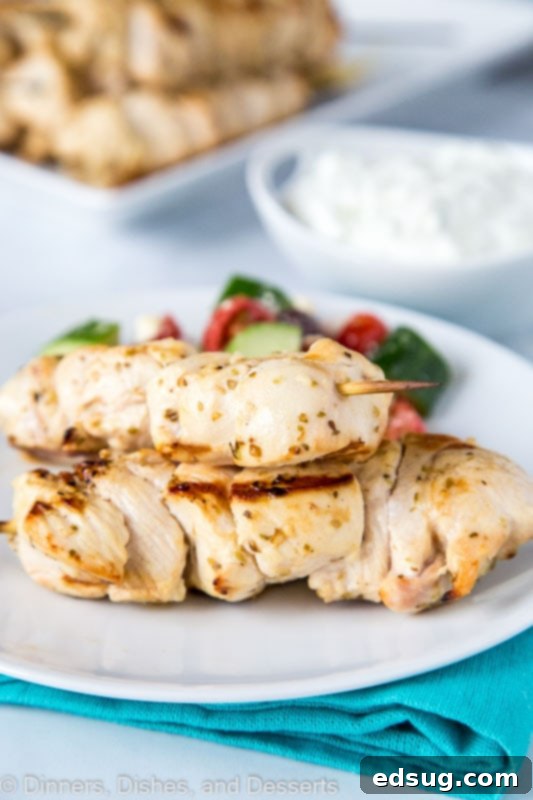 Zesty Chicken Souvlaki Skewers Paired with Creamy Tzatziki 4 Greek chicken skewers with tzatziki sauce and greek salad