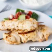 Chicken Souvlaki Skewers with Tzatziki Sauce - tender pieces of Greek chicken that are marinated and grilled to perfection. Served with Tzatziki dipping sauce for a great weeknight dinner.