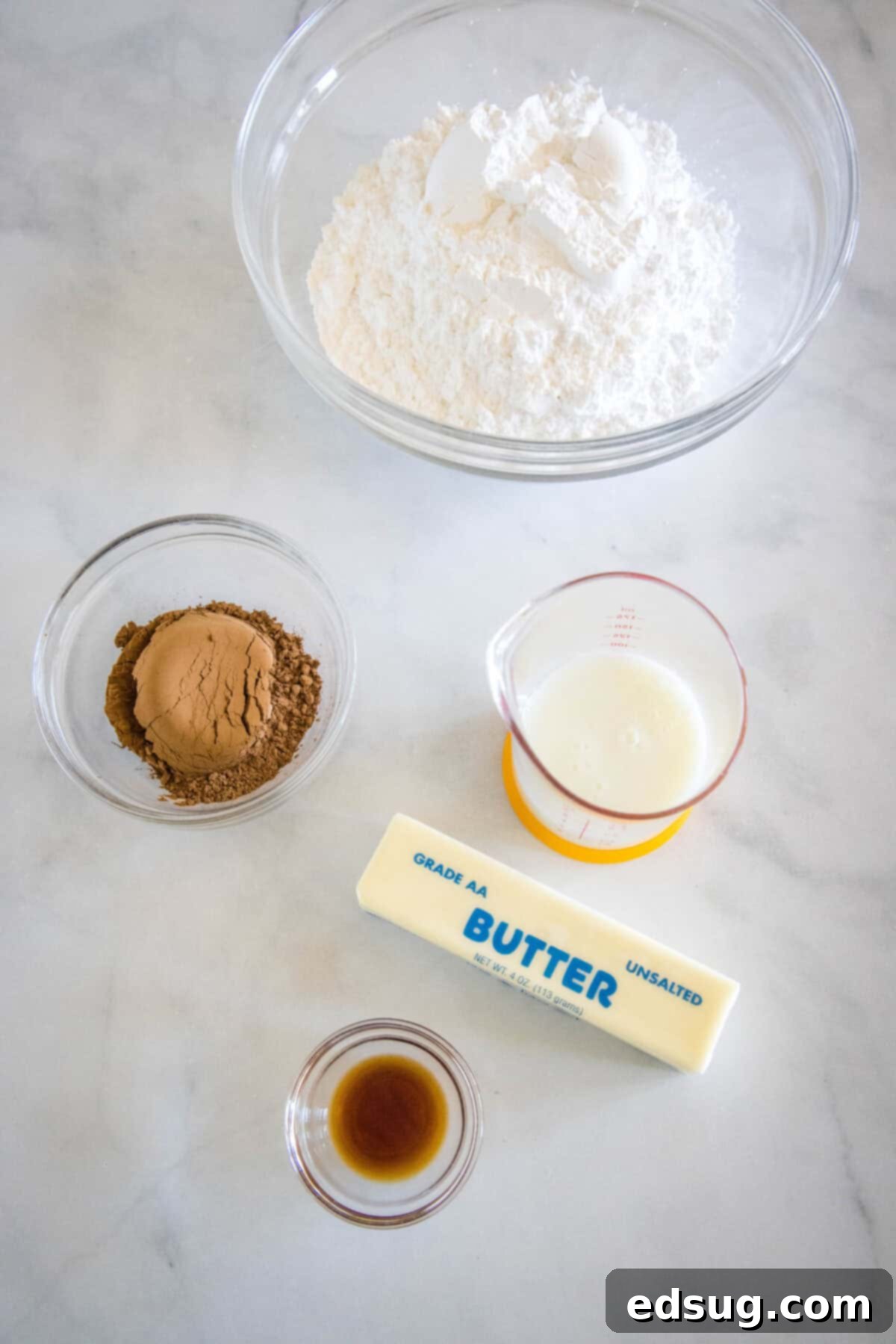 Irresistible Texas Sheet Cake 8 Ingredients for warm chocolate frosting including butter, sour milk, cocoa powder, and vanilla.