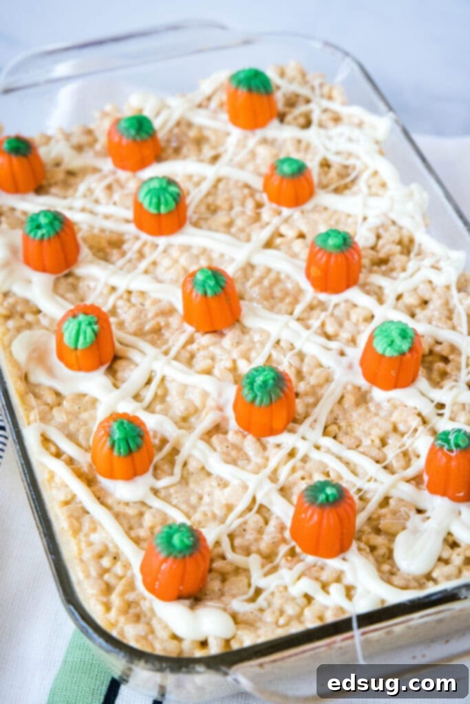 rice krispie treats with pumpkin in a baking dish