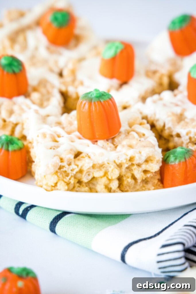 a plate full of pumpkin rice krispie treats