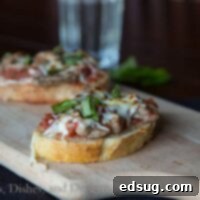 Steak Pizzaiola on a board with fresh basil