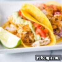Zesty Fish Tacos 7 A plate of fish tacos with different toppings, with Taco