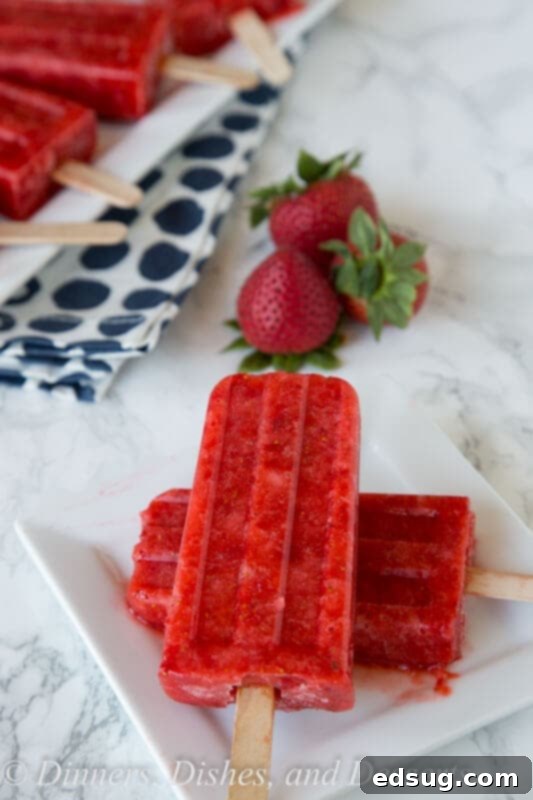 strawberry popsicles on a plate