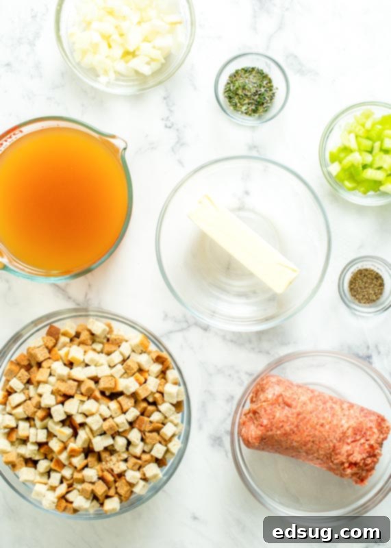 Savory Sausage Mix 4 Raw ingredients for sausage stuffing laid out on a counter: bread cubes, chicken stock, butter, onion, celery, poultry seasoning, pepper, and raw pork sausage.
