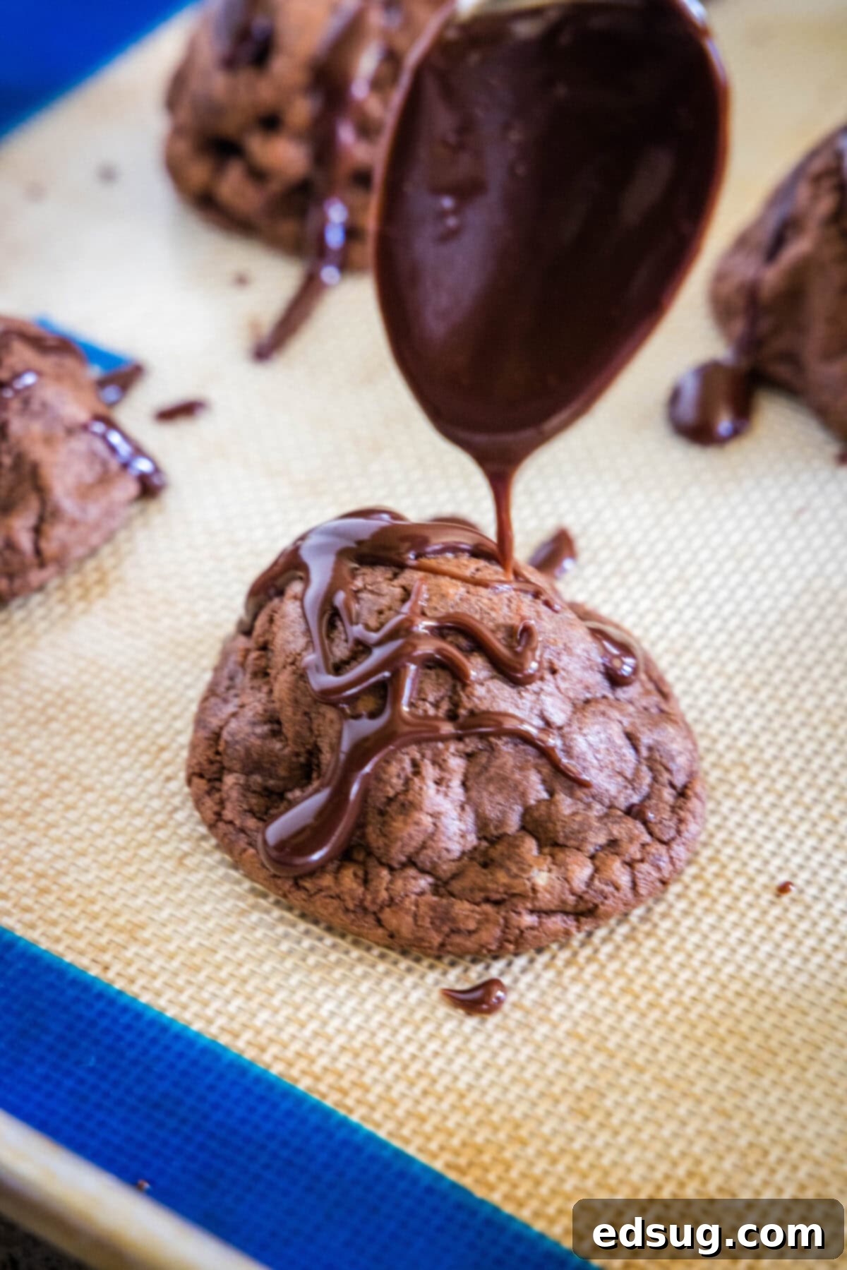 Decadent Chocolate Peanut Butter Truffle Cookies 5 drizzling chocolate ganache over chocolate cookies on a cooling rack