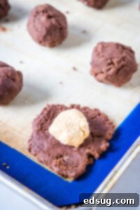 Decadent Chocolate Peanut Butter Truffle Cookies 10 stuffing peanut butter into chocolate cookie dough by hand