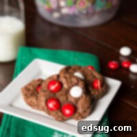 Peppermint White Chocolate Treats 3 Delicious chocolate cookies with festive peppermint M&Ms on top, perfect for the holidays.