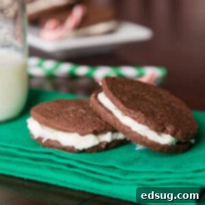 Peppermint Creme Sandwiches 2 Homemade peppermint Oreos close up, showing the dark chocolate cookie and white peppermint filling.
