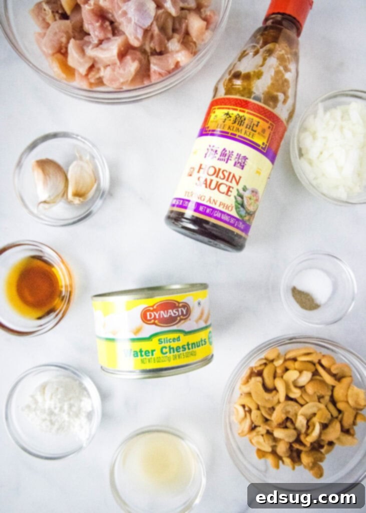 Savory Cashew Chicken Stir-Fry 3 cashew chicken ingredients laid out on a counter, showing fresh chicken, cashews, and sauce components