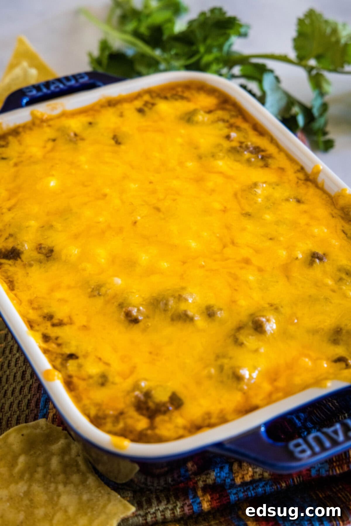 cooked beef enchilada dip in baking dish