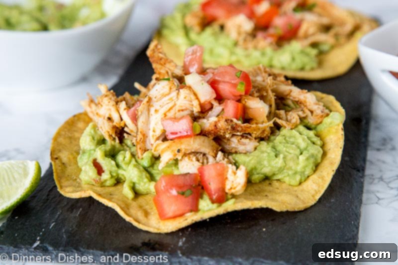 chicken tostada with guacamole on a plate