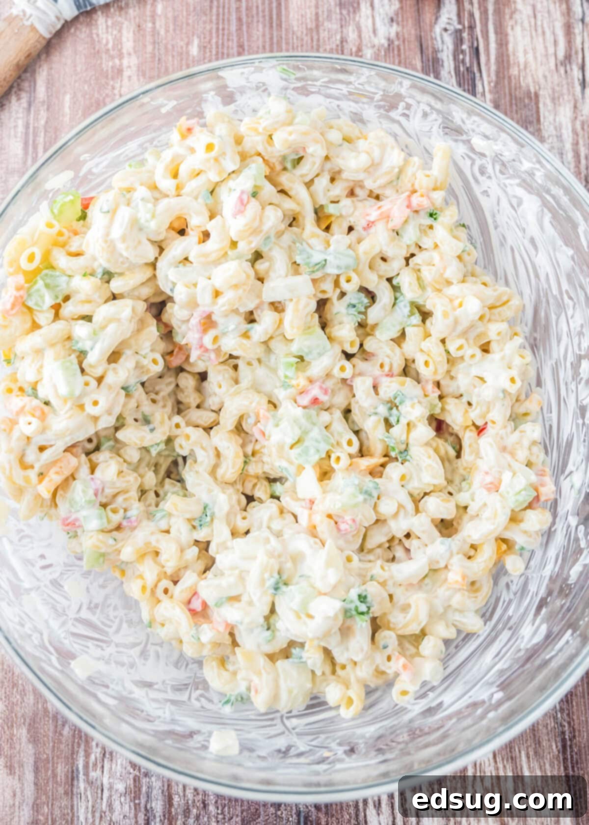 Creamy Macaroni Delight 4 bowl of macaroni salad mixed together