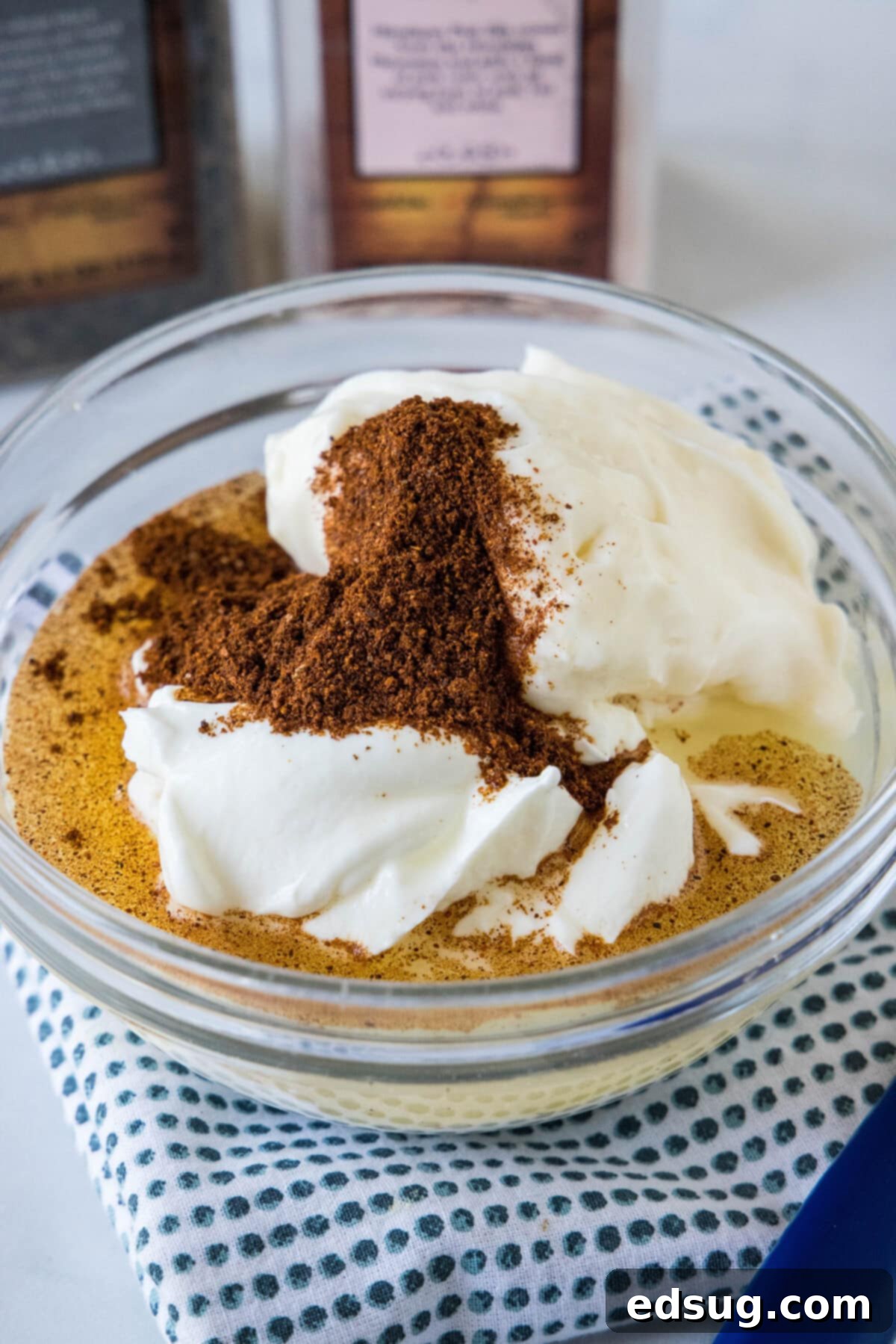 The creamy, zesty dressing for the street corn pasta salad is whisked together in a small bowl.