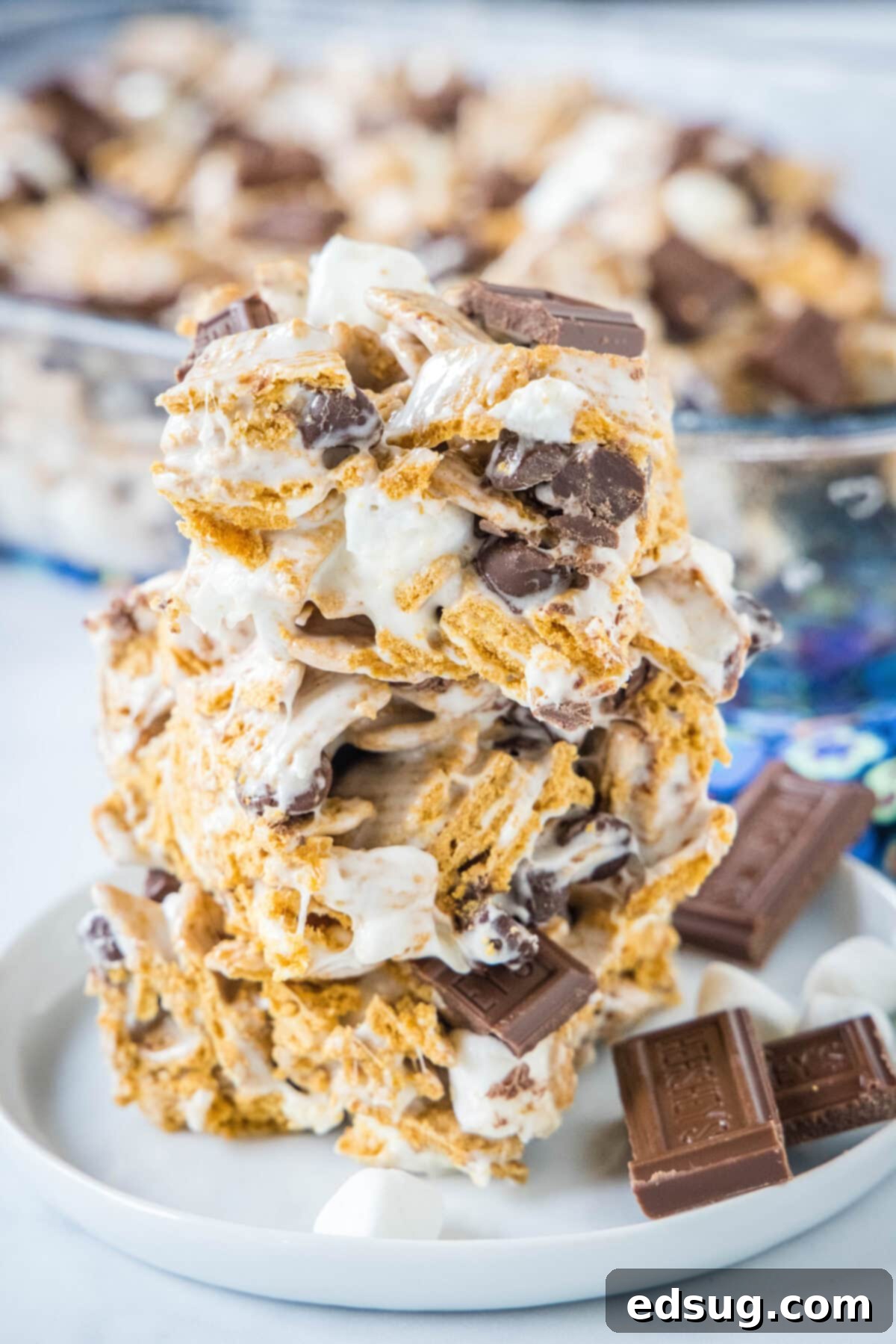 Campfire S'mores Krispie Treats 2 stacked s'mores rice krispie treats stacked on a white plate