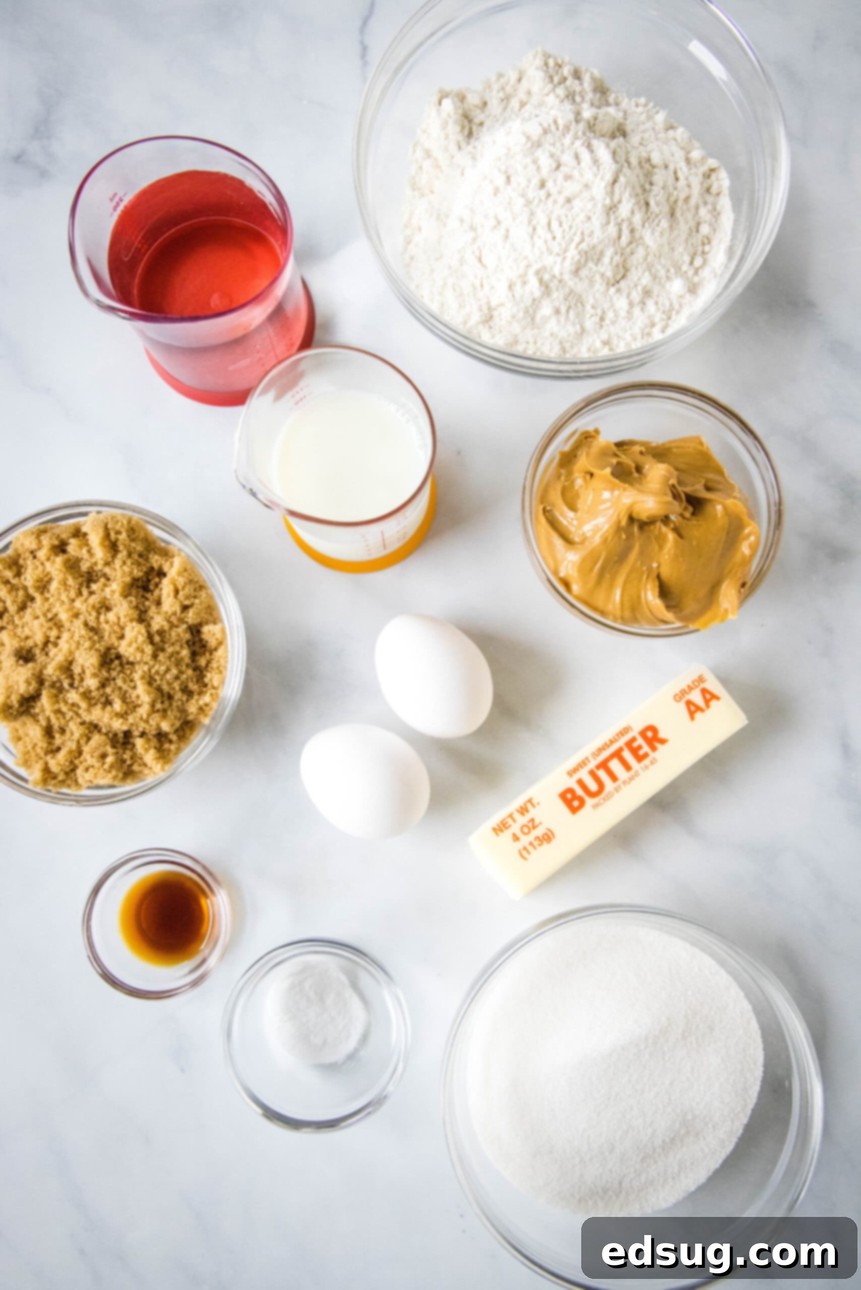 A collection of ingredients necessary for baking a delicious homemade peanut butter cake, neatly arranged on a kitchen counter.