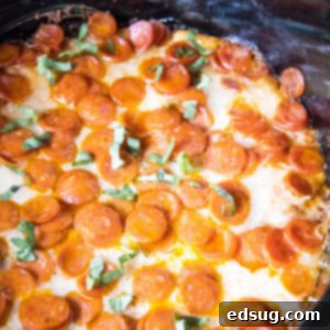 Close up of cooked Crock Pot Pizza Dip in a slow cooker