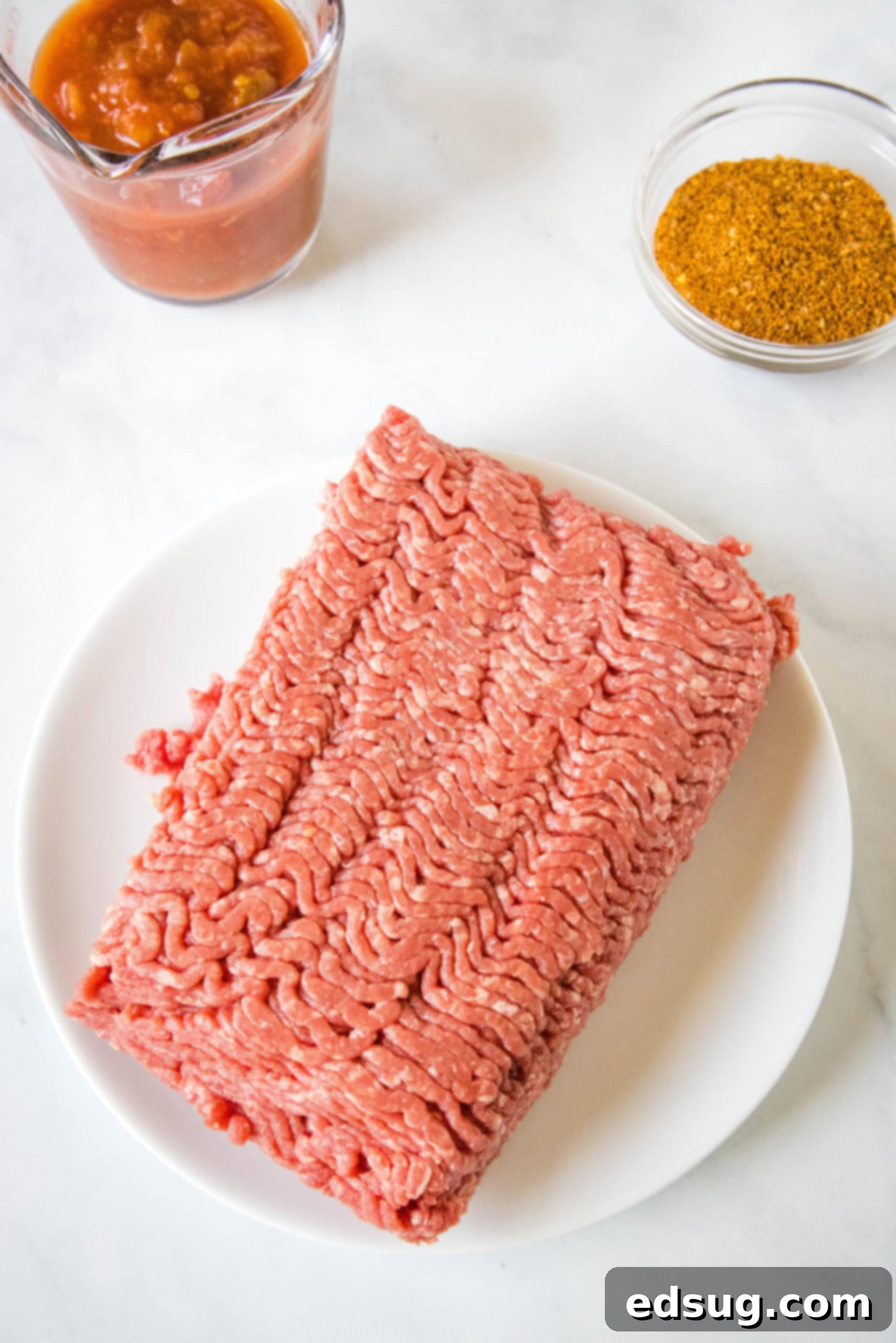 This slow cooker taco meat is an easy, 3-ingredient crock pot recipe that's packed with flavor. Perfect for parties and busy weeknights! Ground beef, salsa, and taco seasoning – the three simple ingredients for slow cooker taco meat.