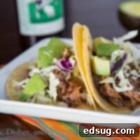 slow cooker chipotle beef tacos on a plate