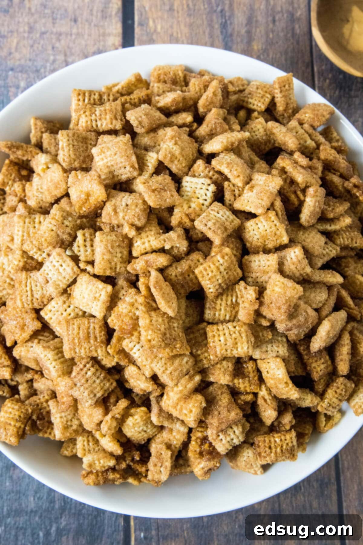 Churro Cinnamon Crunch 5 looking down on a bowl of churro chex mix with cinnamon sugar visible