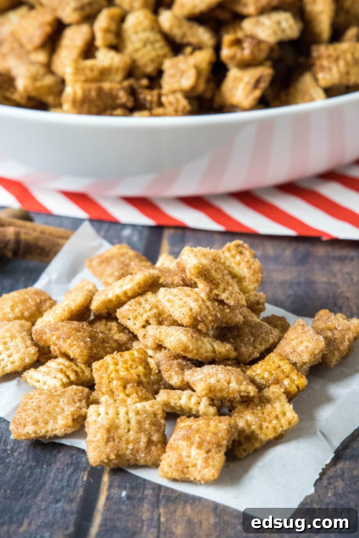 Churro Cinnamon Crunch 6 churro chex mix spread out on parchment paper to cool