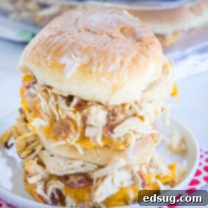 Two chicken bacon ranch sliders stacked on a plate.