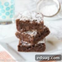 Decadent Nutella Fudge Brownies 6 Nutella Brownies - an absolute chocolate lover's dream! Homemade brownies filled with 3 kinds of chocolate for an absolutely delicious treat!