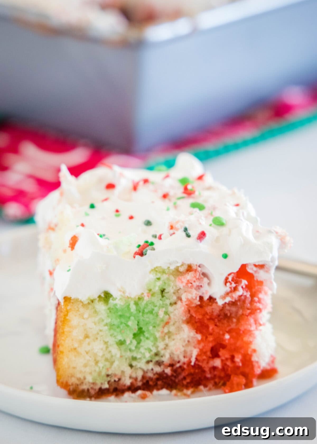 Holiday Hidden Gem 2 christmas poke cake on white plate