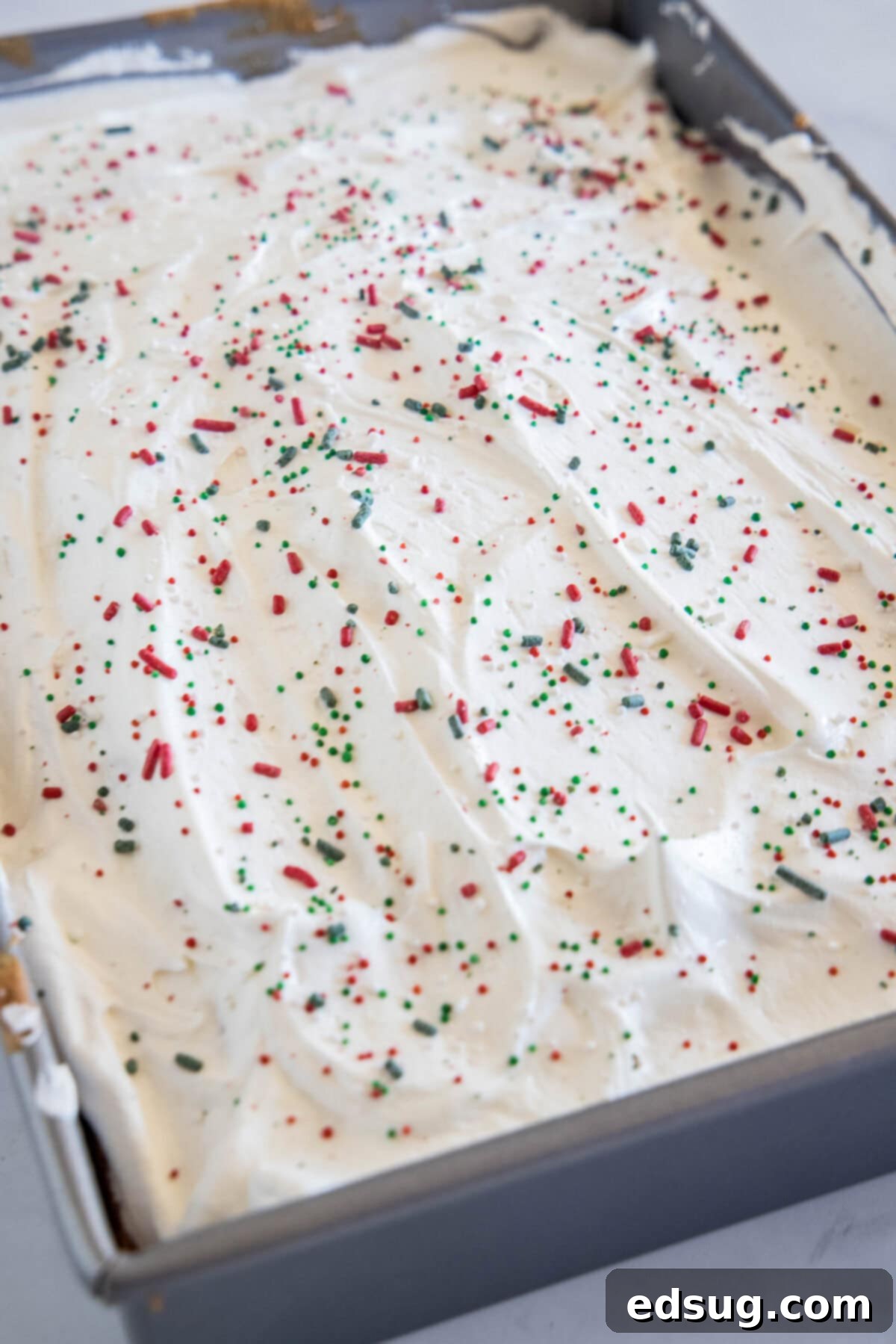 Holiday Hidden Gem 6 cake in baking pan with christmas sprinkles