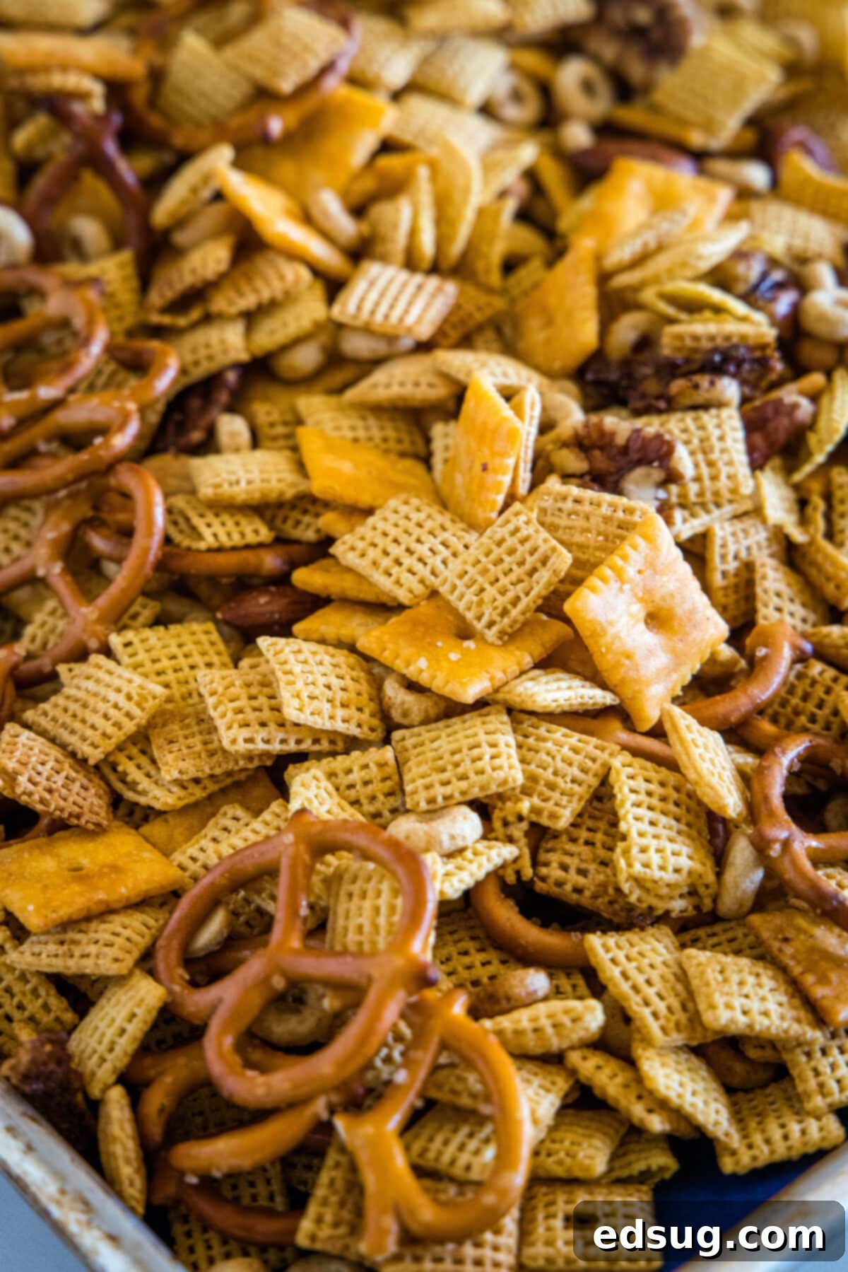 Crock-Pot Party Crunch 6 chex mix cooling on a baking sheet