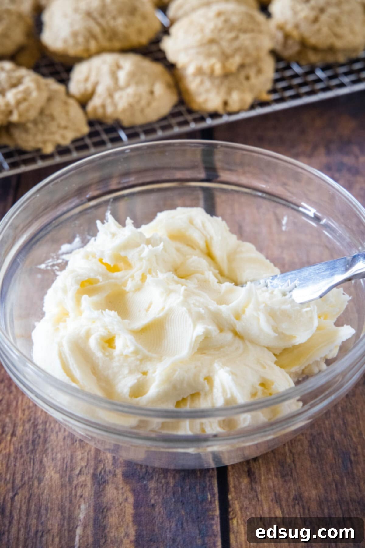 Festive Eggnog Cookies 4 creamy eggnog frosting in a bowl, ready to be spread onto the cookies.