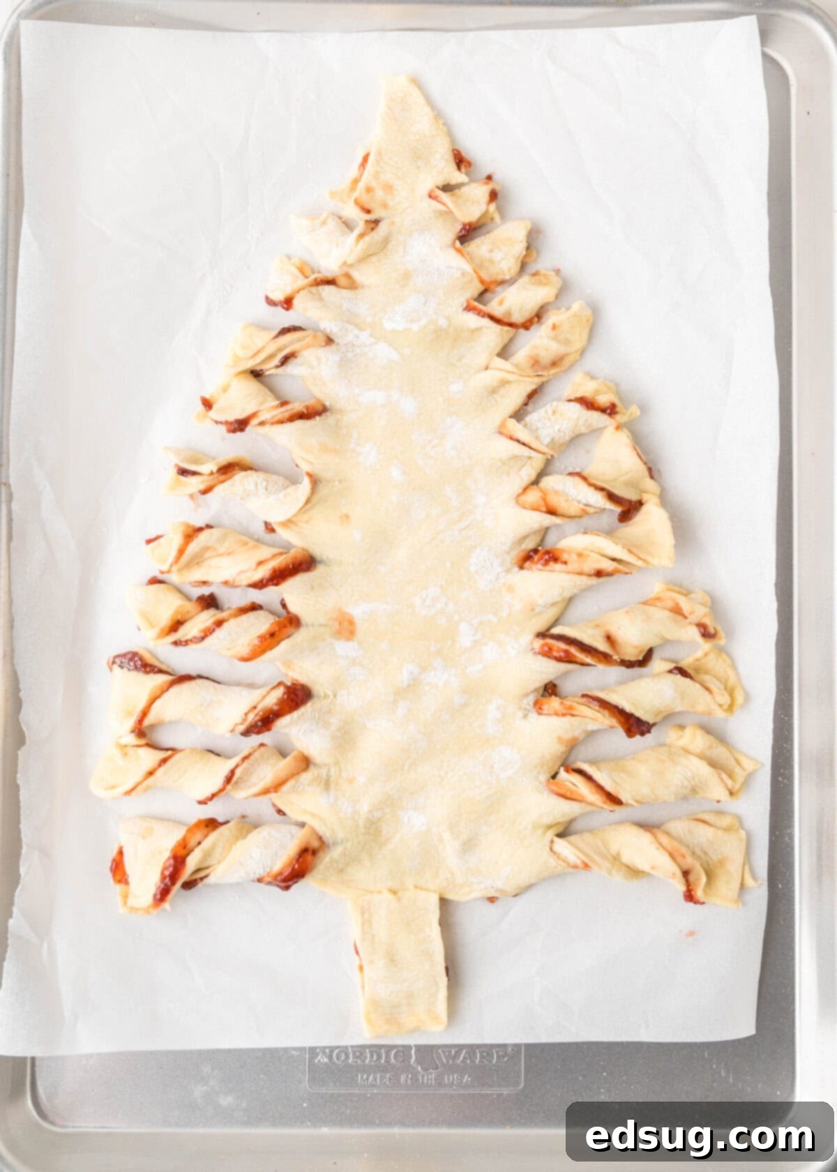 Holiday Swirl Pastry Tree 7 The twisted branches of the puff pastry Christmas tree, showing the rustic and inviting texture before baking.