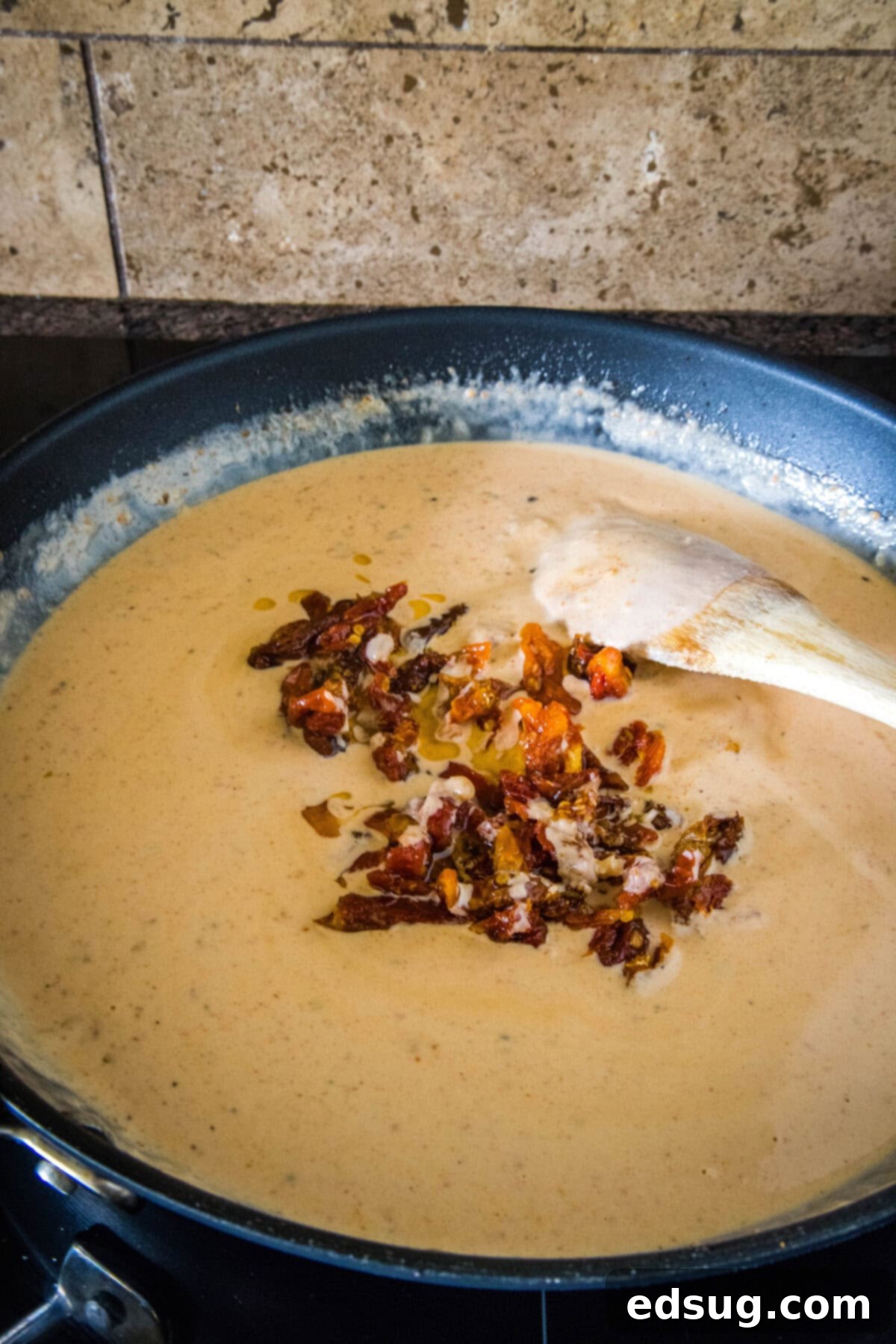 Flavor-packed Marry Me Chicken pasta is a 30-minute, one-pan weeknight dinner with tender pasta and chicken in creamy sun-dried tomato sauce. Sun-dried tomatoes added to a creamy sauce in a skillet.