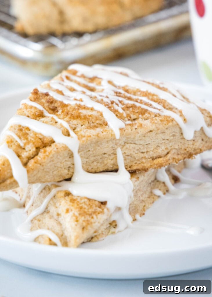 cinnamon scones stacked on a white plate