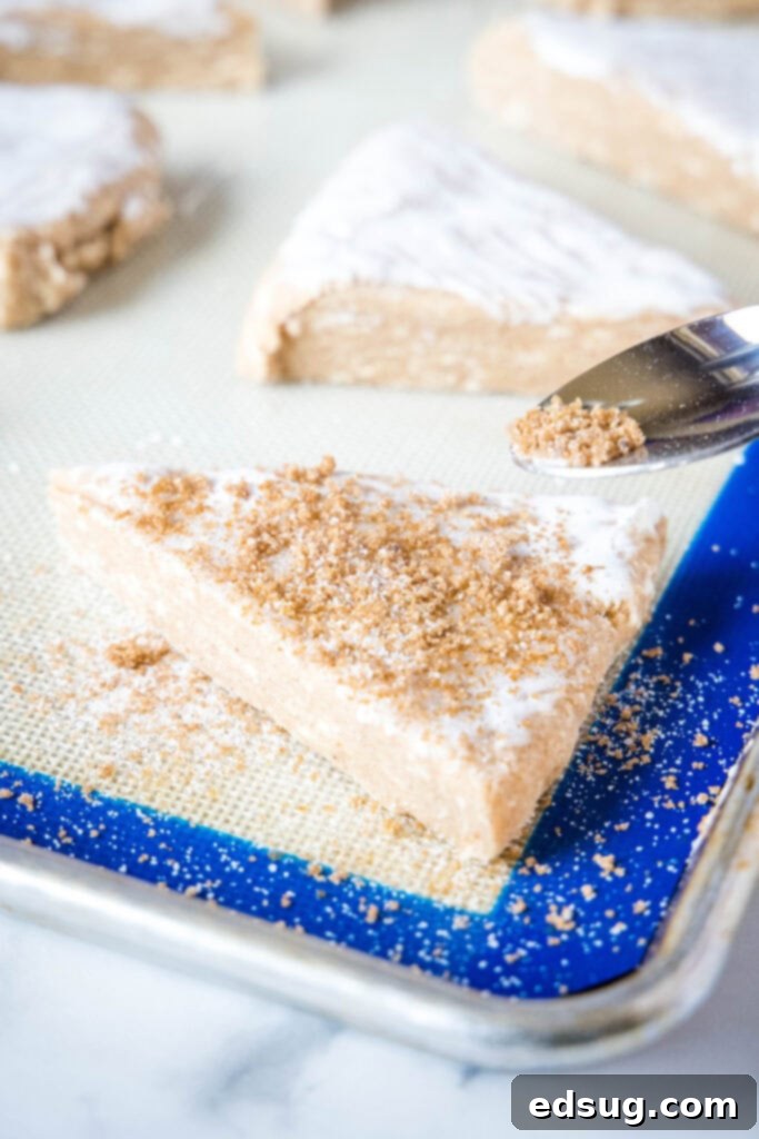 sprinkling cinnamon and sugar over scones