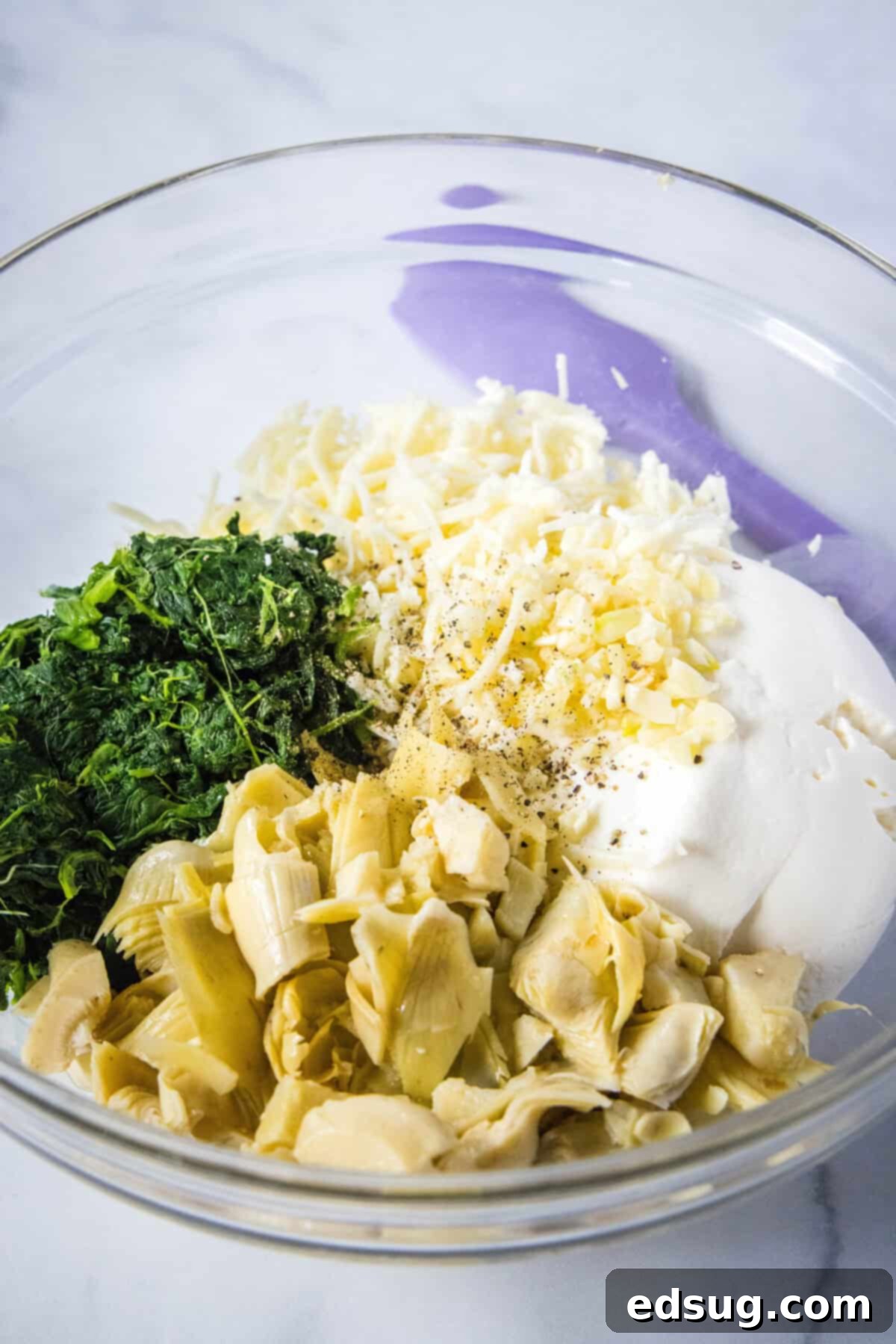 spinach stuffed shell filling in a mixing bowl