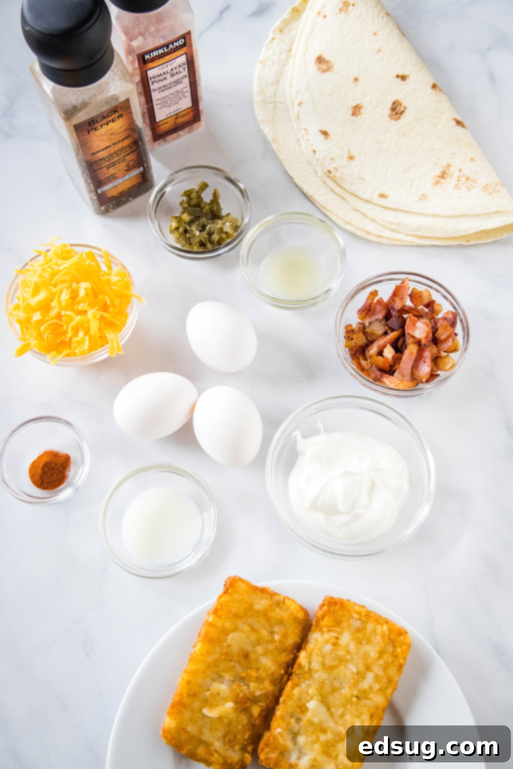 All the fresh ingredients needed to prepare a homemade breakfast crunchwrap, neatly arranged.