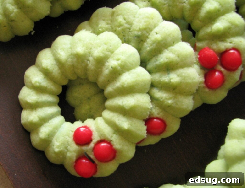 holly wreath spritz cookies on serving tray