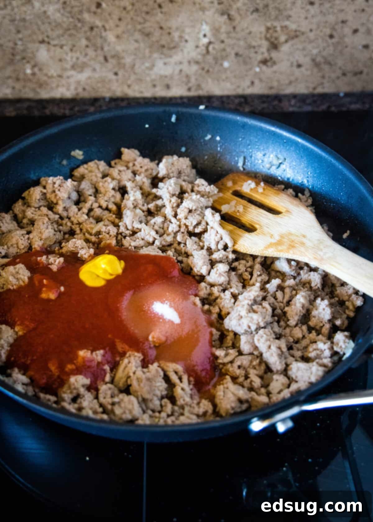 Easy ground turkey Sloppy Joes made with juicy turkey instead of ground beef, cooked in one pan with a rich, flavor-packed homemade sauce! Tomato sauce, mustard, Worcestershire, sugar, salt, and pepper added to cooked ground turkey and onions in a skillet.