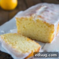 Bright Grapefruit Yogurt Cake with a Zesty Drizzle 2 grapefruit yogurt cake sliced on a board