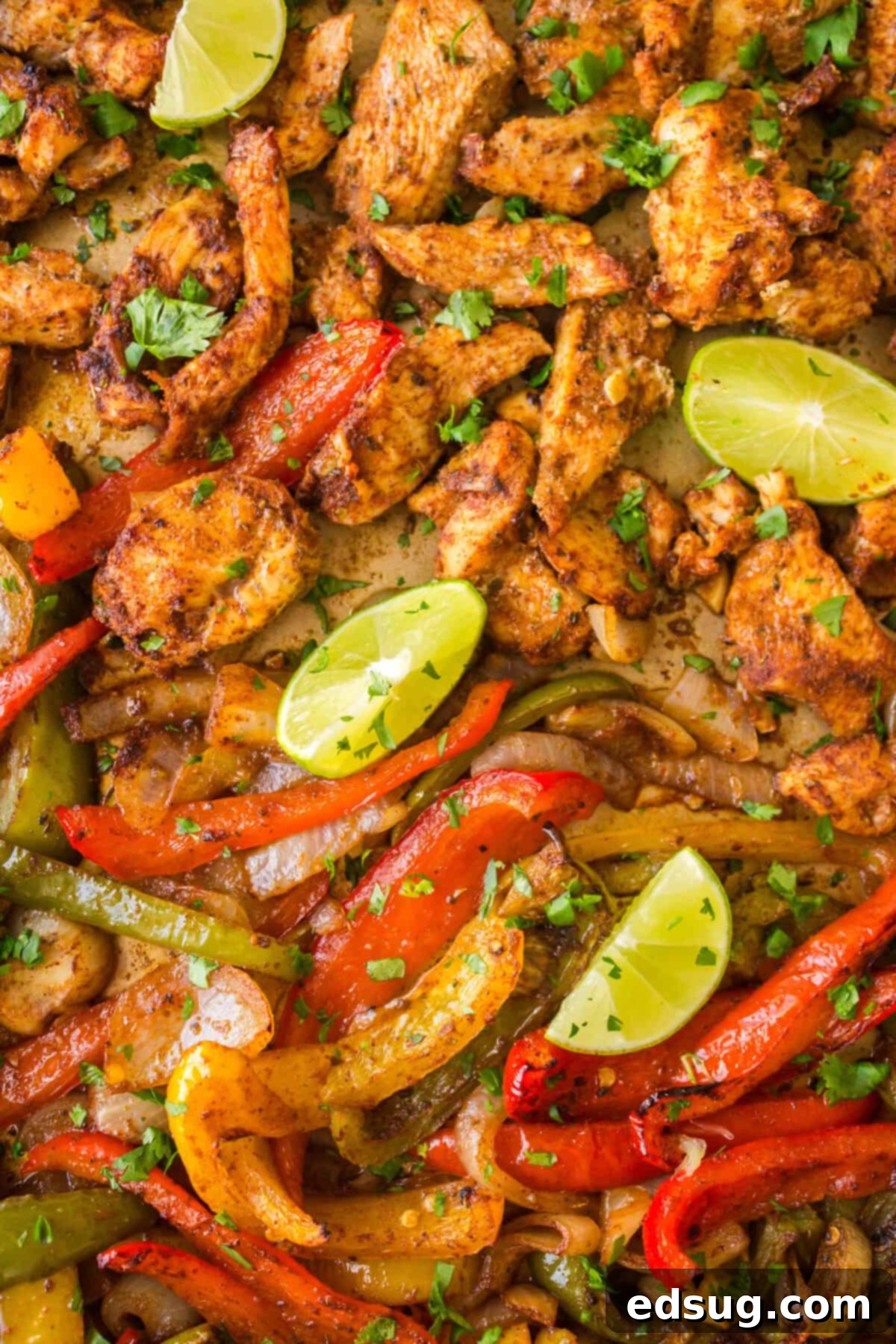 One-Pan Chicken Fajitas 6 baked sheet pan chicken fajitas on a baking sheet