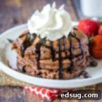 Irresistible Chocolate Pancakes 9 cropped chocolate pancakes picture with chocolate sauce and whipped cream