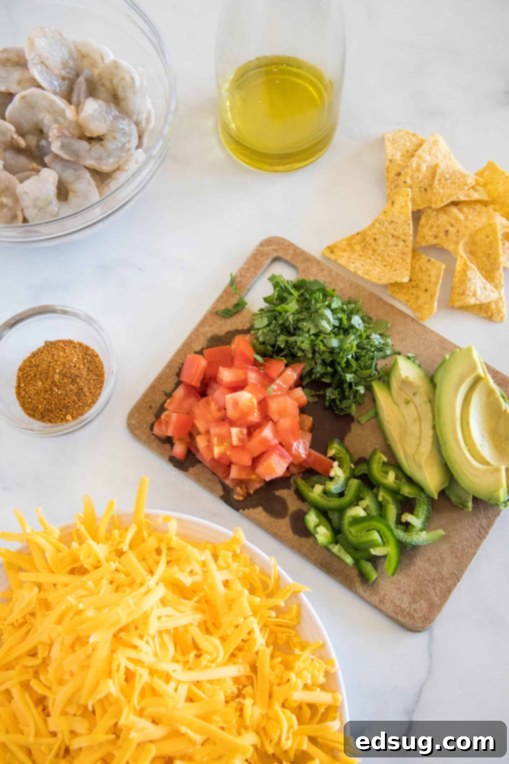 Upgrade classic nachos with zesty seasoned shrimp! These shrimp nachos are an easy Tex-Mex appetizer packed with flavor, ready in 15 minutes. Shrimp nachos ingredients and toppings.