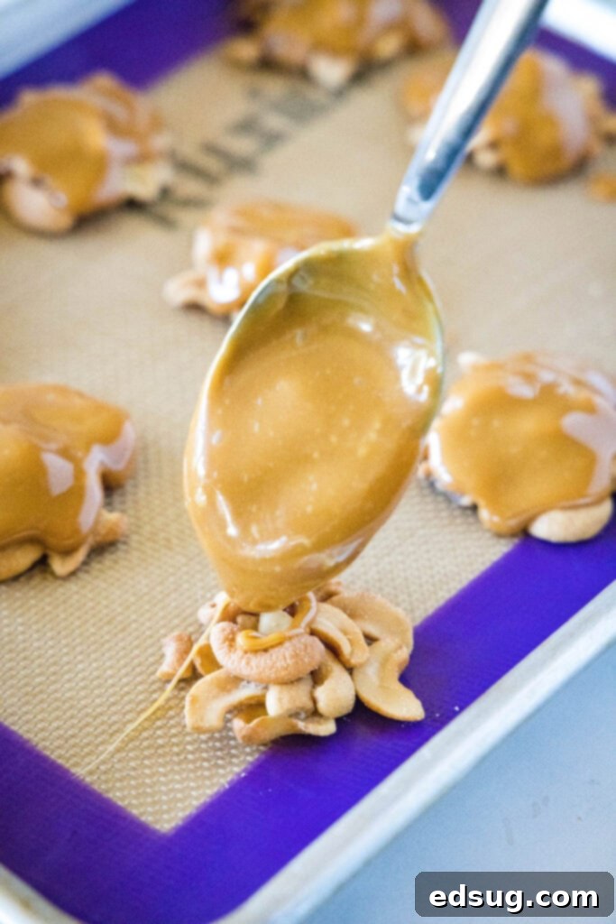 spooning caramel over cashews